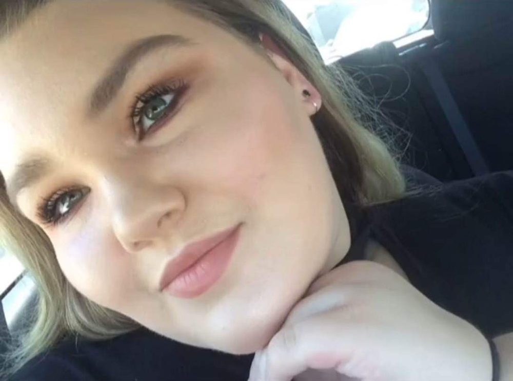 Marissa smiling in a car